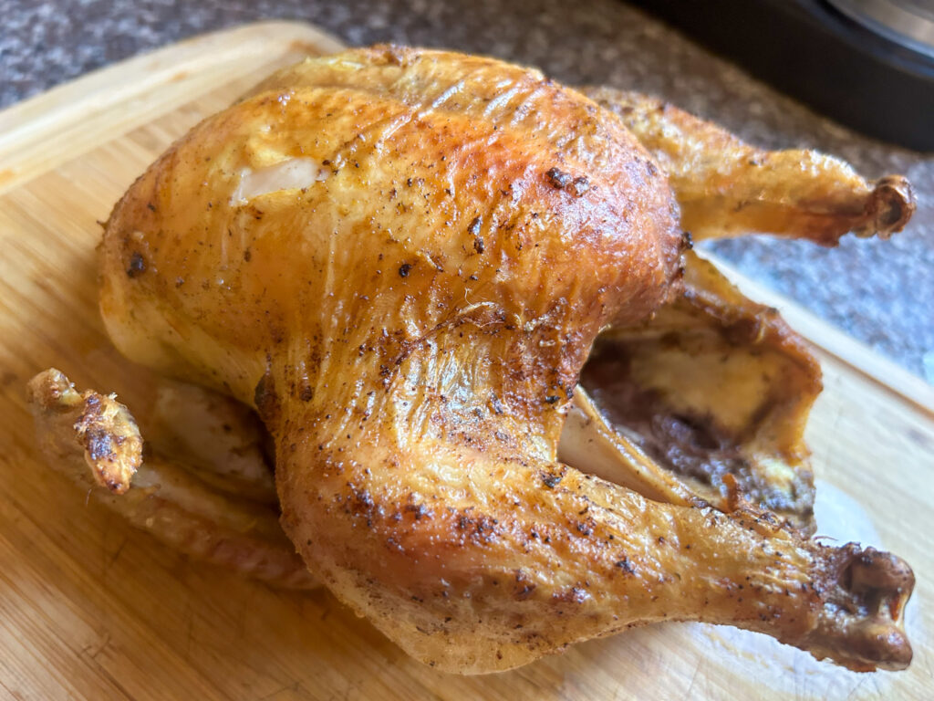 Roast chicken on a cutting board