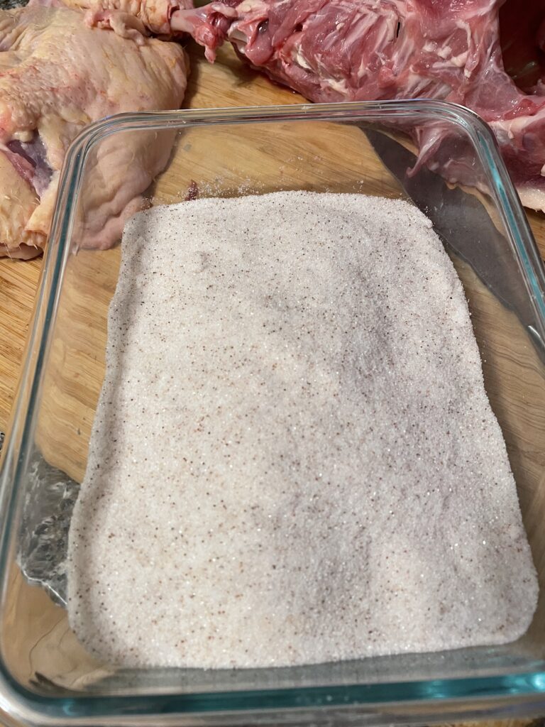 Duck breast covered completely in salt