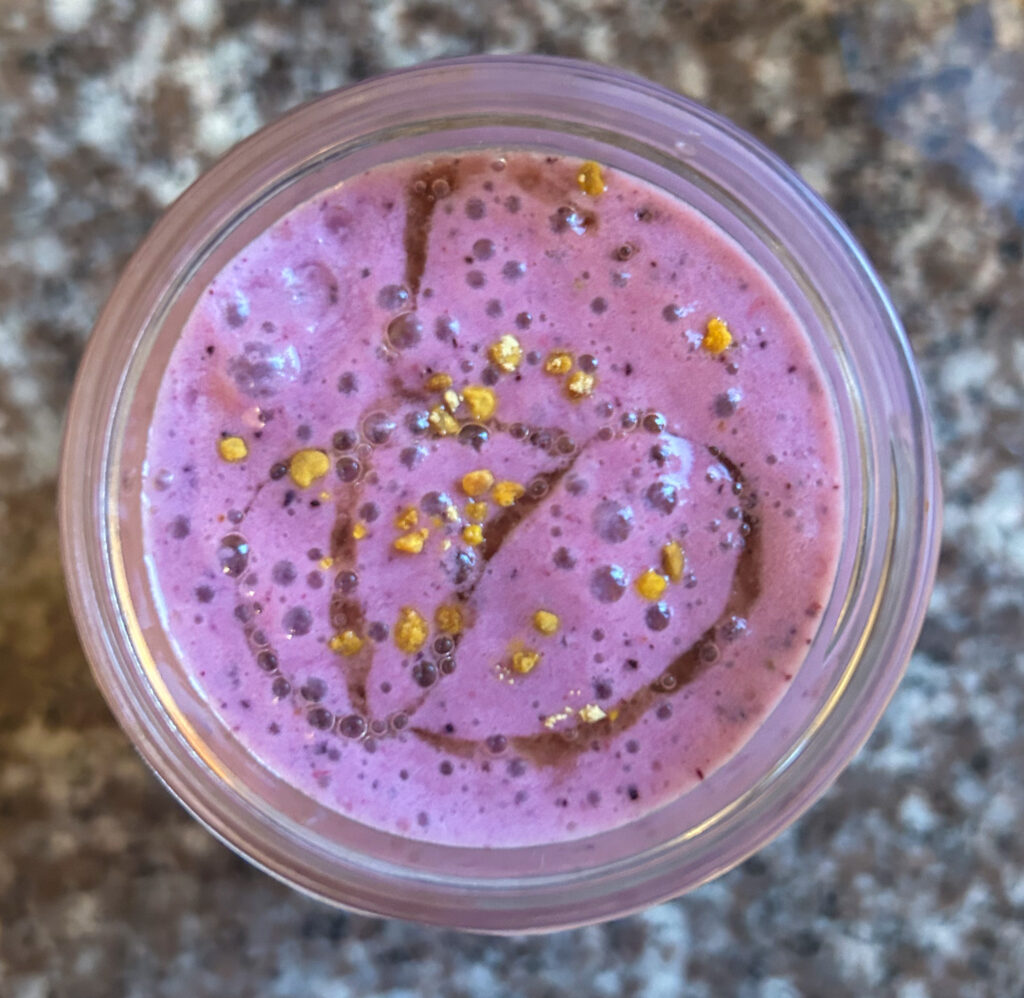 Blueberry kefir smoothie topped my maple syrup and bee pollen. 